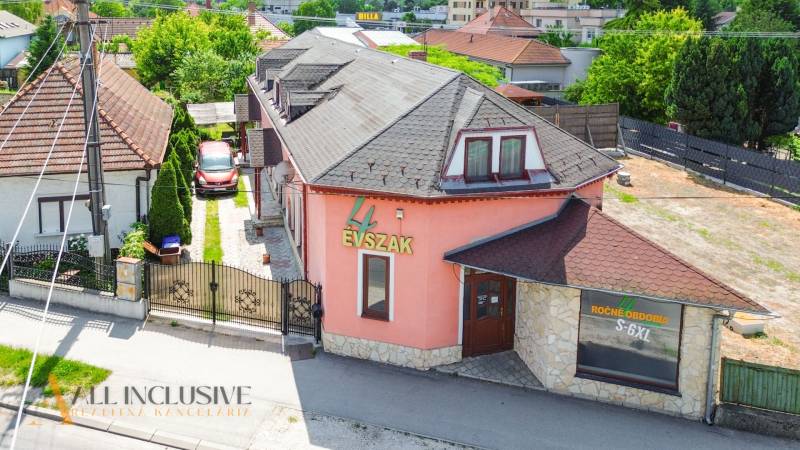 Family house with a shop on Gyulu Szabóa Street in Dunajská Streda, surrounded by a garden.