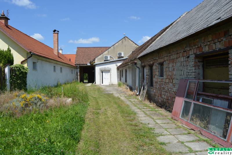 Exterior near commercial premises in Borský Svätý Jur with a garden and buildings.