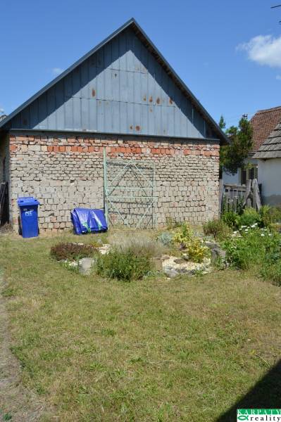 In Borský Svätý Jur, you can see commercial spaces with a brick structure and a garden.