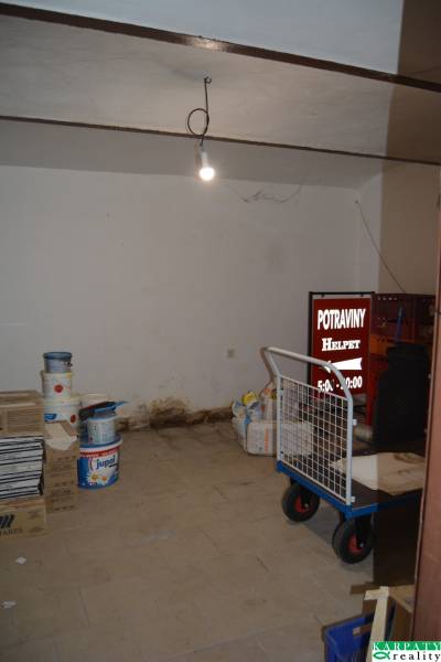 A warehouse in commercial premises with materials and tools, without partitions or equipment.