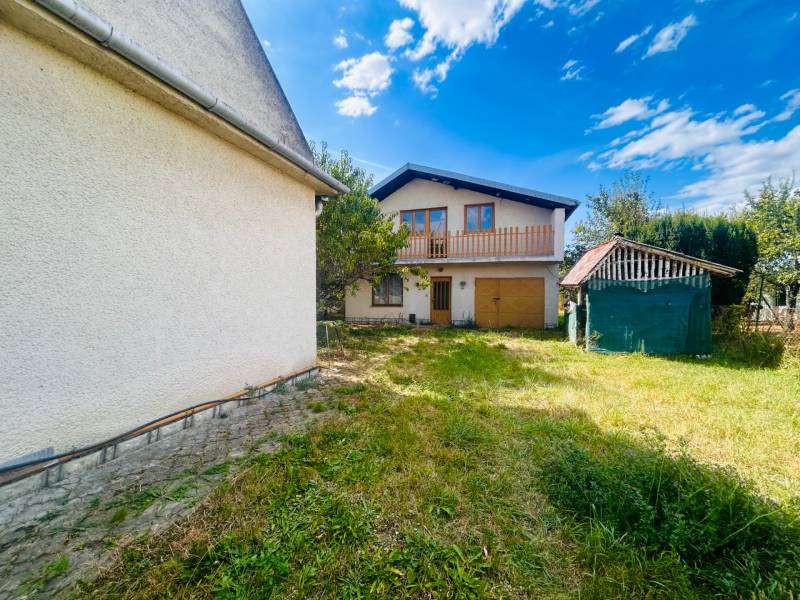 A family house in Sobrance with a spacious garden, garage, and a small shelter on the property.