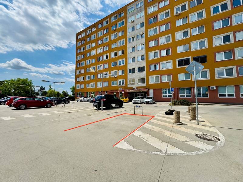 Parking lot in front of the apartment building on Učňovská Street in Košice-Šaca.