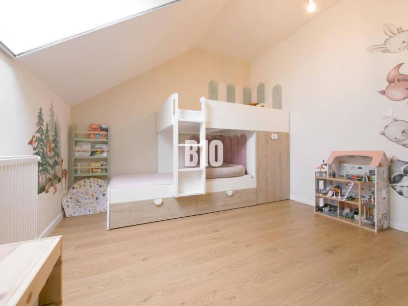 Children's room with a bunk bed and wooden floor in a 3-room apartment.
