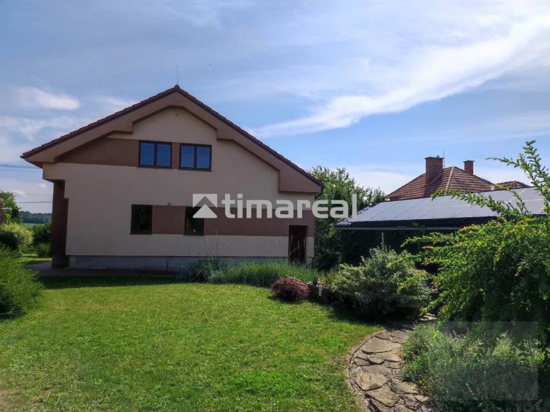 A family house with a lawn and plants in Myjava.