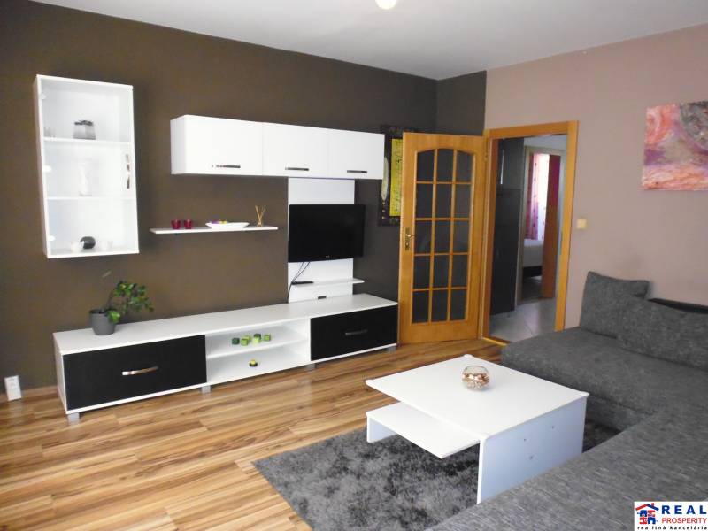 Living room with a TV, sofa, and furniture in a 3-room apartment.