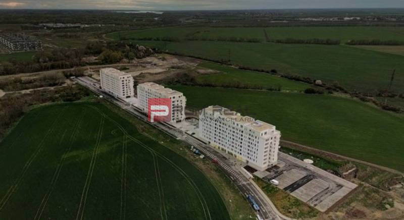 Buildings on Labutia Street in Bratislava V surrounded by greenery and fields.