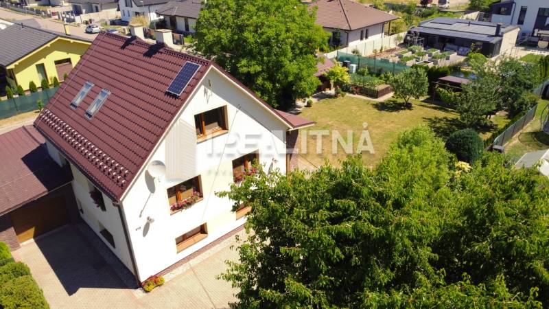 A family house in Kriváň on Kriváň street with a spacious garden and well-maintained lawn.