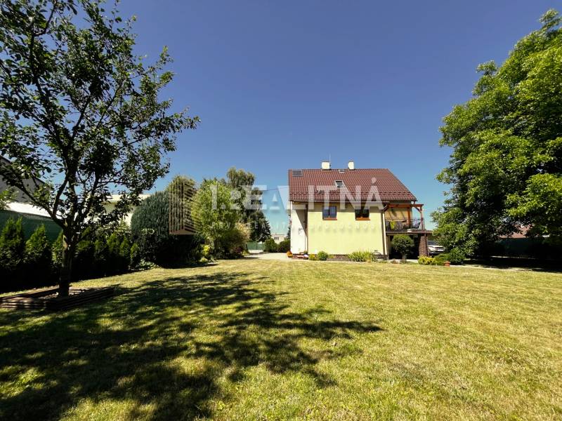 A family house in Kriváň with a large garden on Kriváň street, surrounded by greenery and trees.