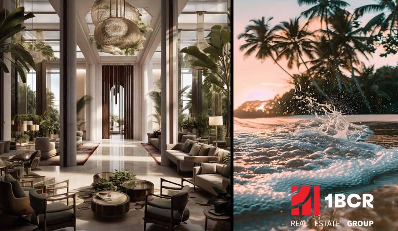 Construction of apartments with a sophisticated entrance hall and a beach in the background.