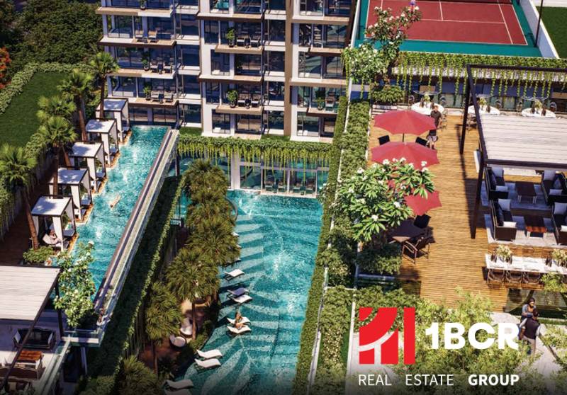The construction of apartments in Pattaya includes a pool, terraces, and greenery for residents.