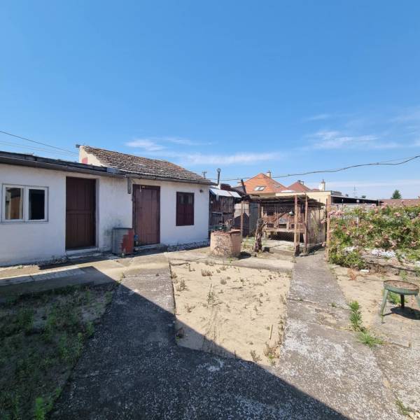 The courtyard of a family house on Riadok in Malacky with older amenities and a garden.