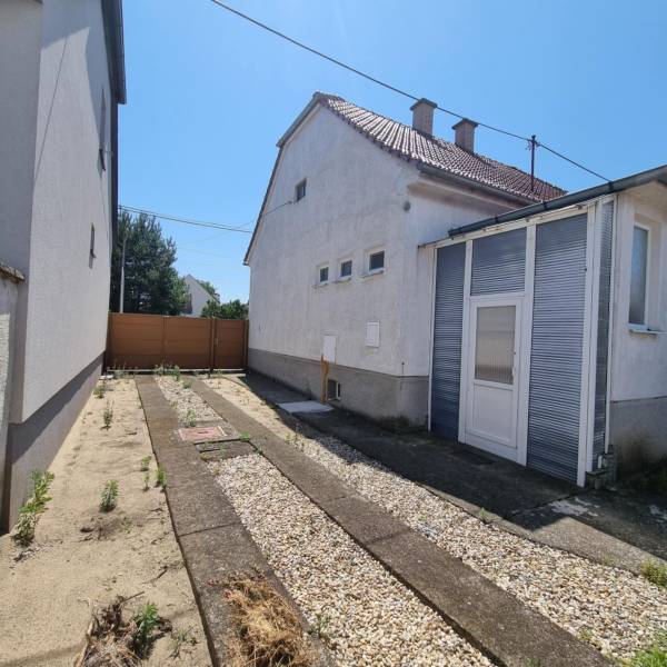 Family house on Riadok Street in Malacky with a yard featuring gravel and concrete.