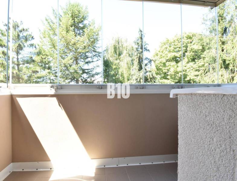 Glazed balcony with a view of greenery in a 3-room apartment in Bytča.