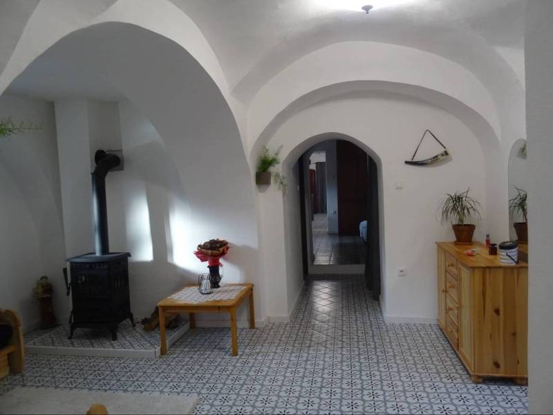 Brick vaults and a stove in the cozy interior of a family house.
