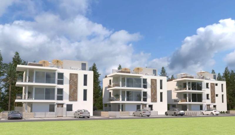 Apartment buildings with modern architecture and balconies, suitable for a 2-room apartment.