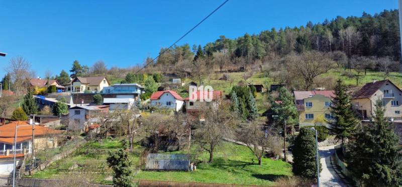Houses on a slope with a forest on the outskirts of Považská Bystrica.