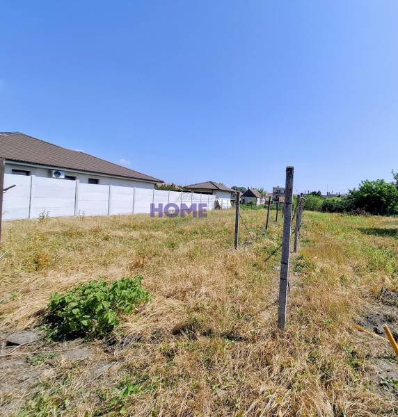 A plot with grass and a fence ready for living in Čierna Voda on Čierna Voda Street.