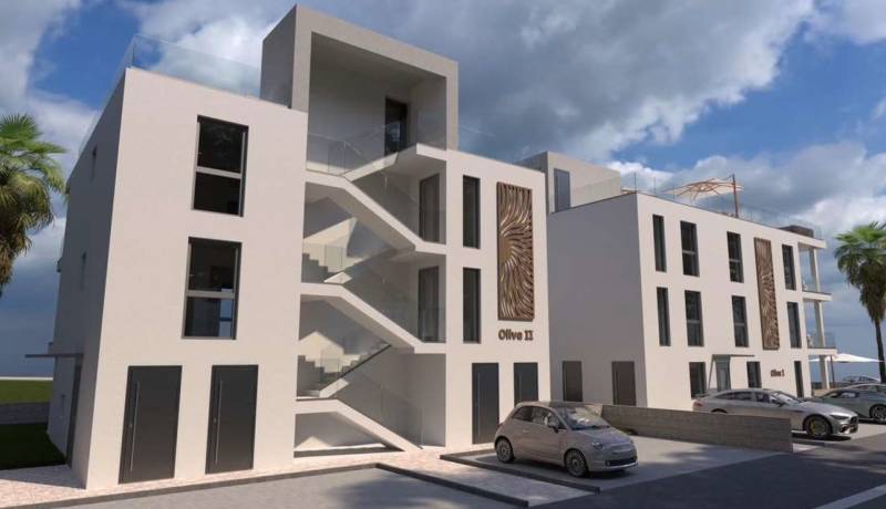 A modern building with parking and palm trees in the city of Vir, including a 2-room apartment.