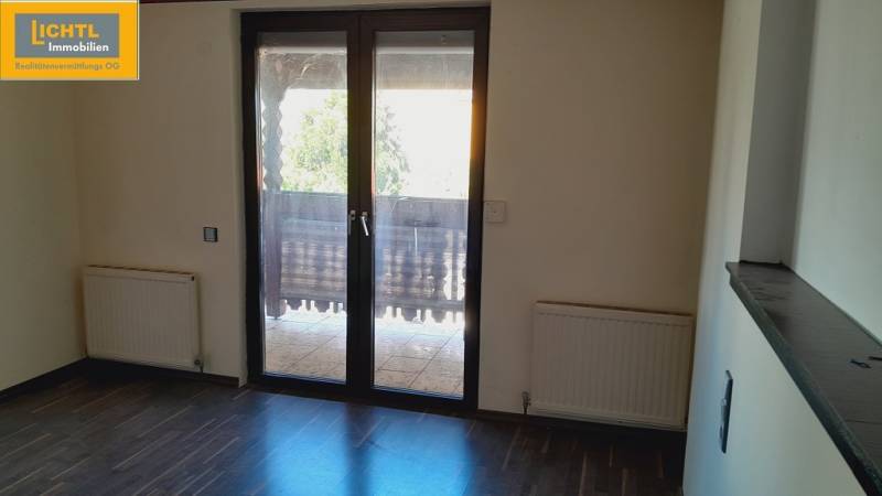A room with balcony doors and radiators, Apartment construction.