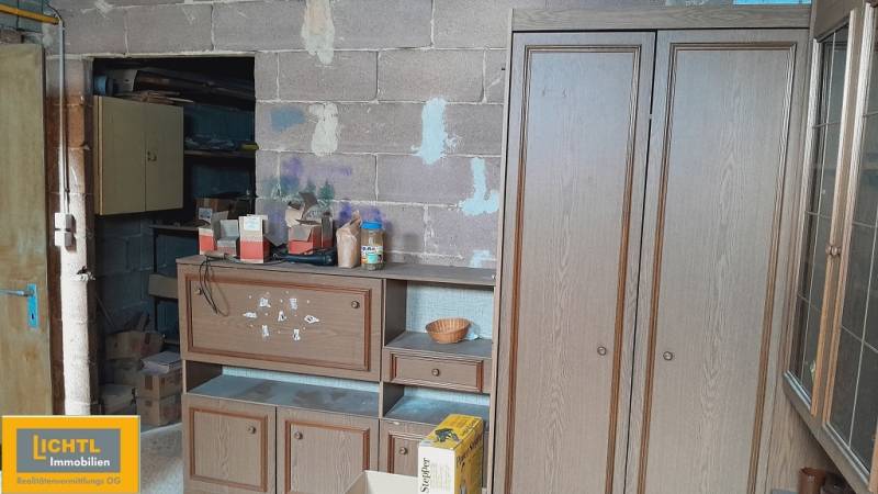 Interior with shelves and boxes during apartment construction, various materials and tools.