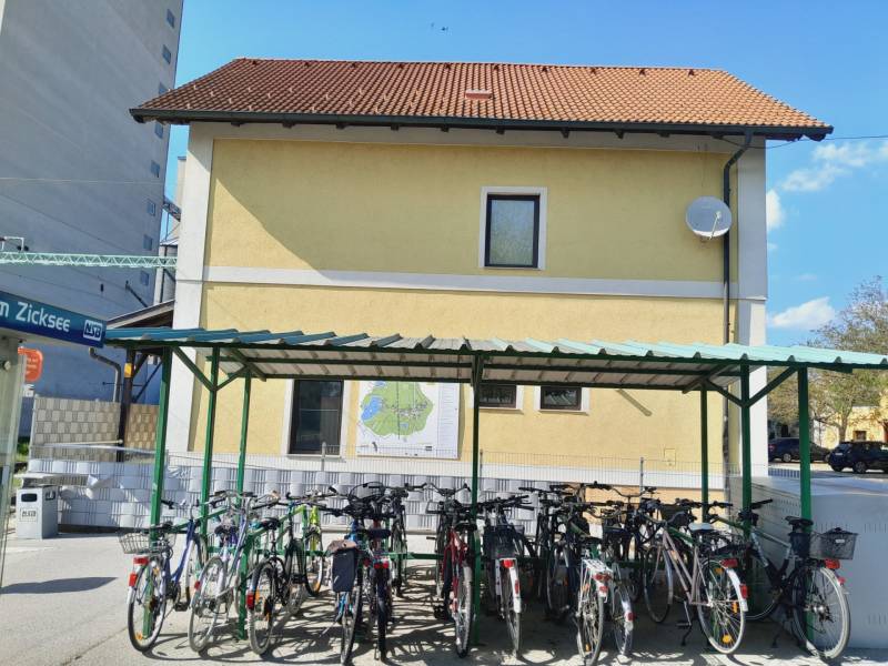 Bicycles parked in the shelter in front of commercial premises in St. Andrä am Zicksee.