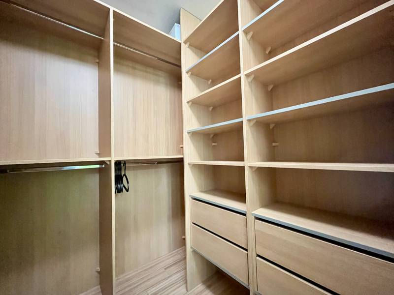 Built-in wardrobe with shelves and drawers in a 2-room apartment.