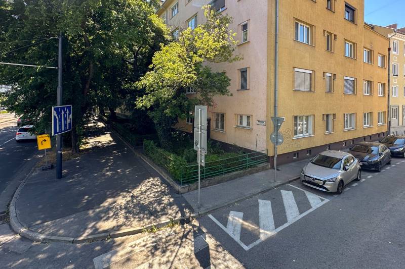 Karadžičova Street in Bratislava - Old Town with a building and parked cars.