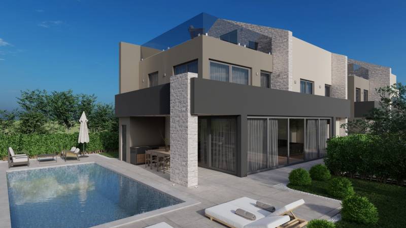 Villa in Poreč with a pool, terrace, sun loungers, and greenery in a peaceful environment.