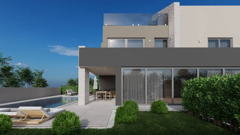 Villa in Poreč with a garden, pool, and terrace under the blue sky.