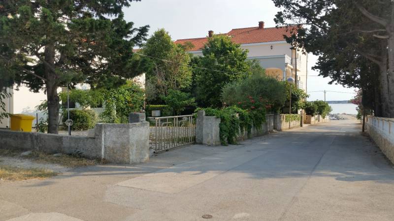 A family house in the village of Vrsi with surrounding greenery and a sea view.