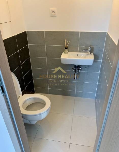 Bathroom in a 2-room apartment with a toilet and a sink.