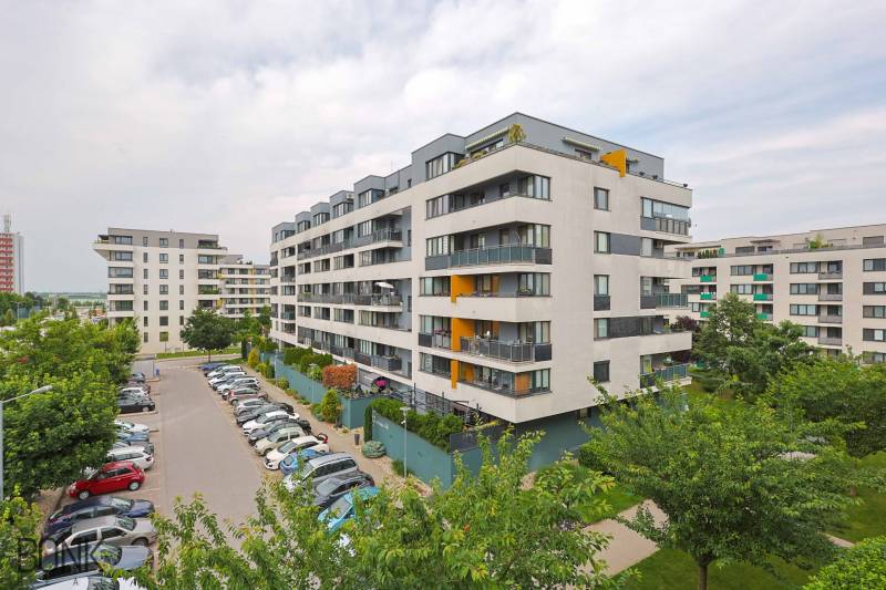 Residential complex on Veterná Street in Trnava with parking spaces and greenery.