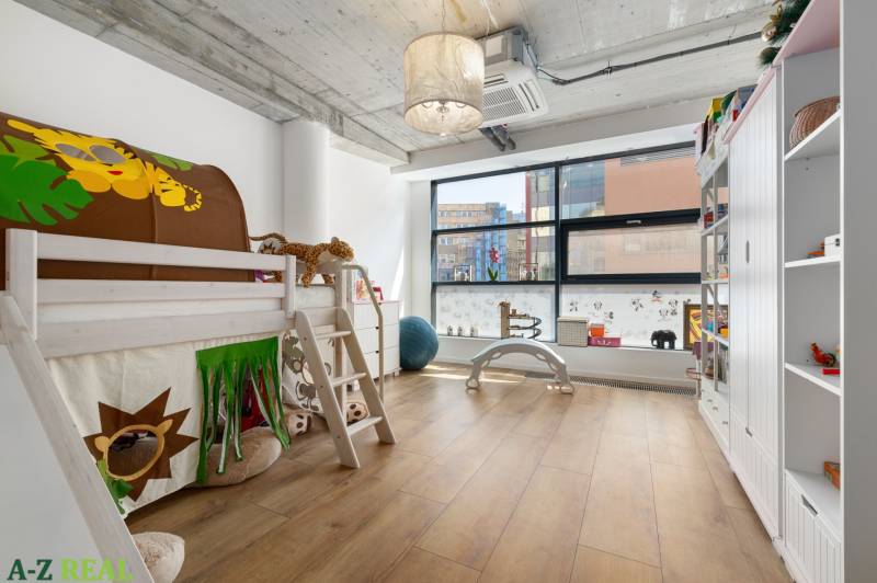 Children's room with a bunk bed and a large window in a 4-room apartment.