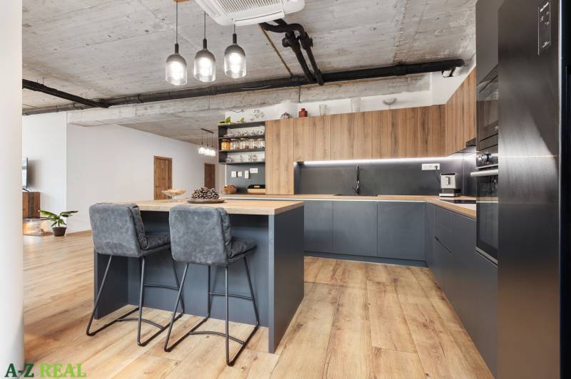 A kitchen in a 4-room apartment with stylish chairs and wooden furniture.