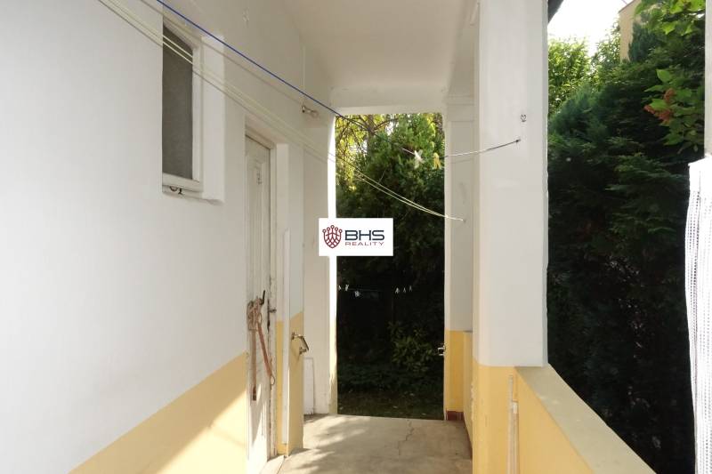 Entrance area of a family house with doors and greenery, Hviezdoslavova Street, Piešťany.