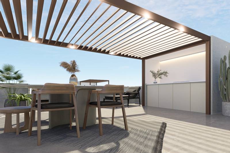 A terrace in a 4-room apartment with a pergola, table, chairs, and plants for relaxation.