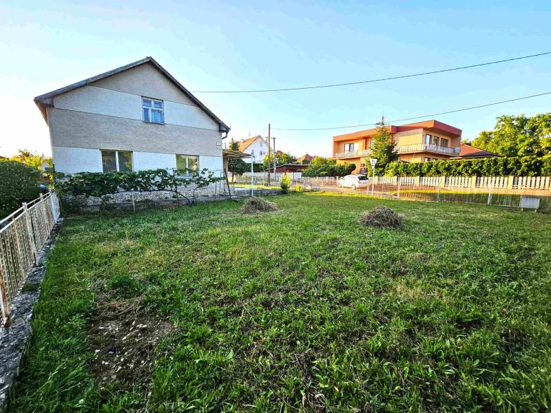 A family house in Kuzmice with a large yard and a well-maintained garden.