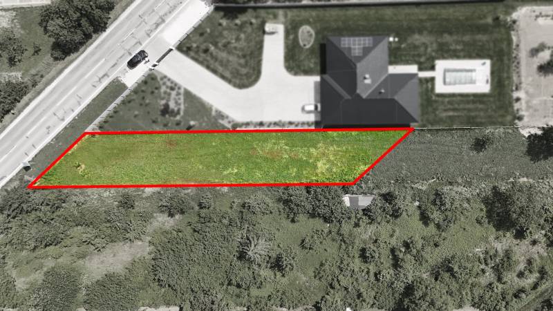 Aerial view of a residential plot in Nové Mesto nad Váhom, next to an asphalt road.