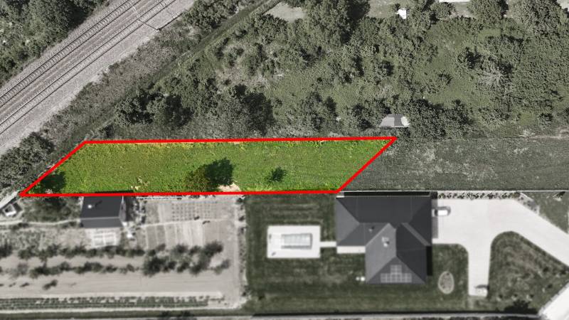 Aerial view of a residential plot in Nové Mesto nad Váhom near the railway track.