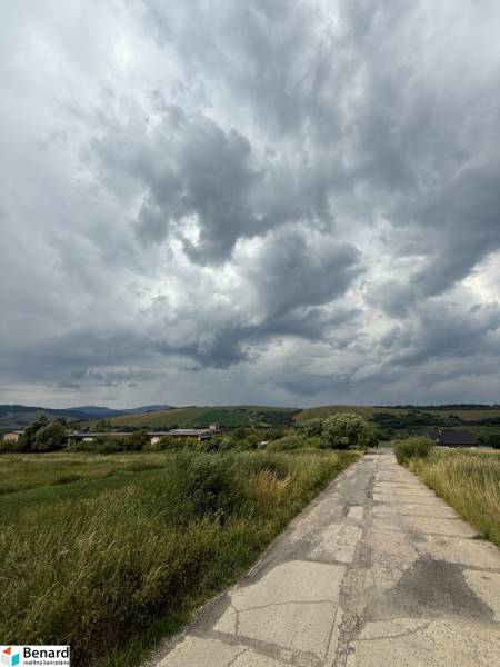 Landscape with clouds and a country road in Ľubotín, ideal for commercial land.