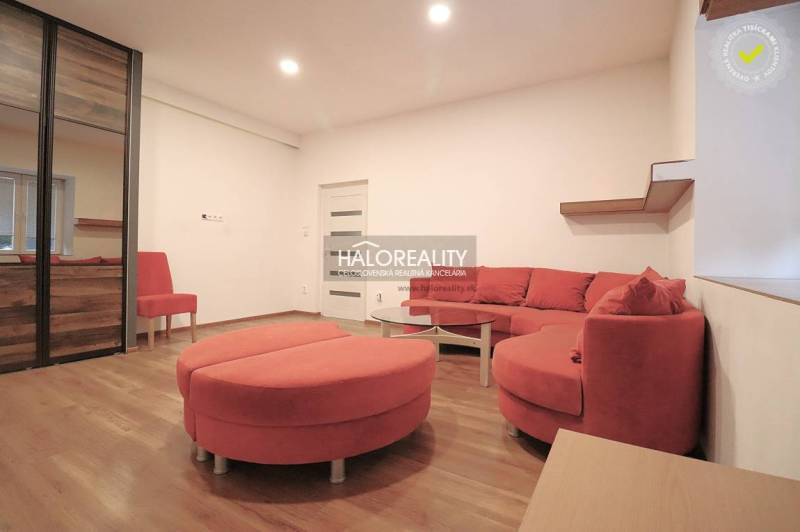 Living room, red corner sofa, mirrored wardrobe, round table, ideal for a family house.