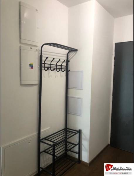 Entrance hall with a coat rack in a 2-room apartment.