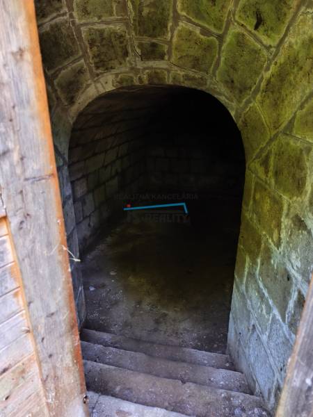 Stone cellar in a family house, Hont, with an atmospheric vaulted ceiling and stone stairs.