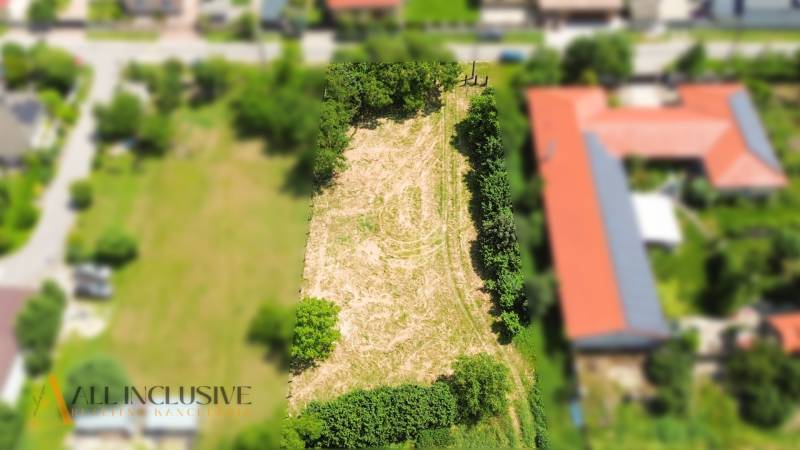 Building plot in Kynceľové Kračany in Dunajská Streda, surrounded by greenery and development.