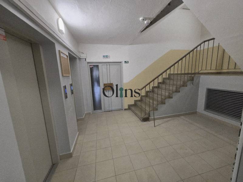 Entrance hall with staircase and elevator in the building, suitable for a 2-room apartment.
