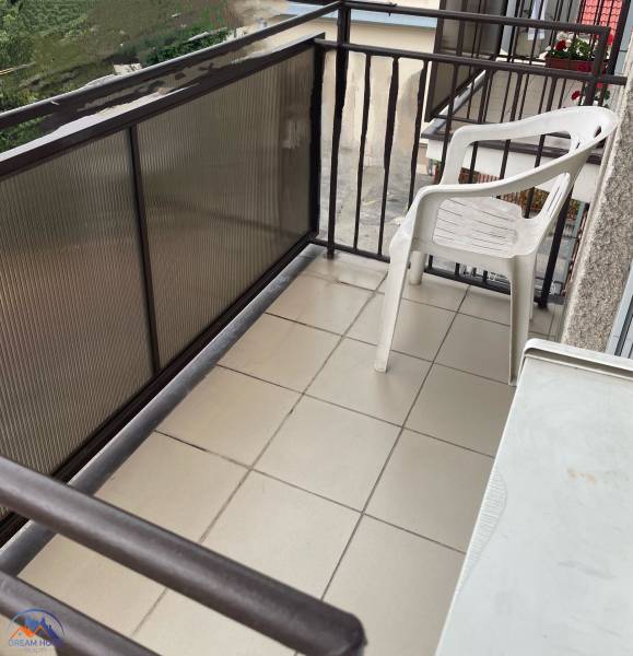 A balcony with a plastic chair in a 3-room apartment in Komárno.