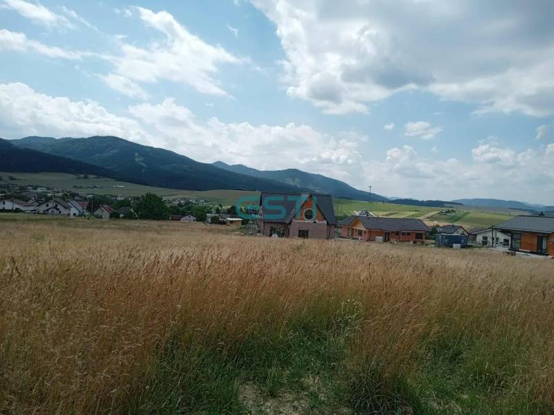 Countryside in Kunerad, Residential Land - with views of mountains and rooftops.