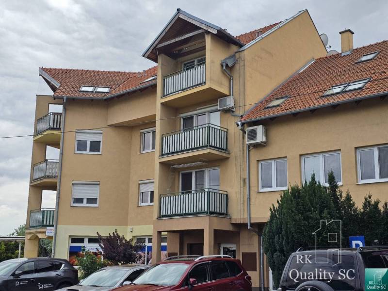Apartment building on Kysucká Street in Senec with parking and balconies.
