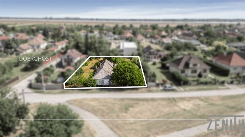 Summer panorama in Dobrohošť with residential plots and surrounding nature.