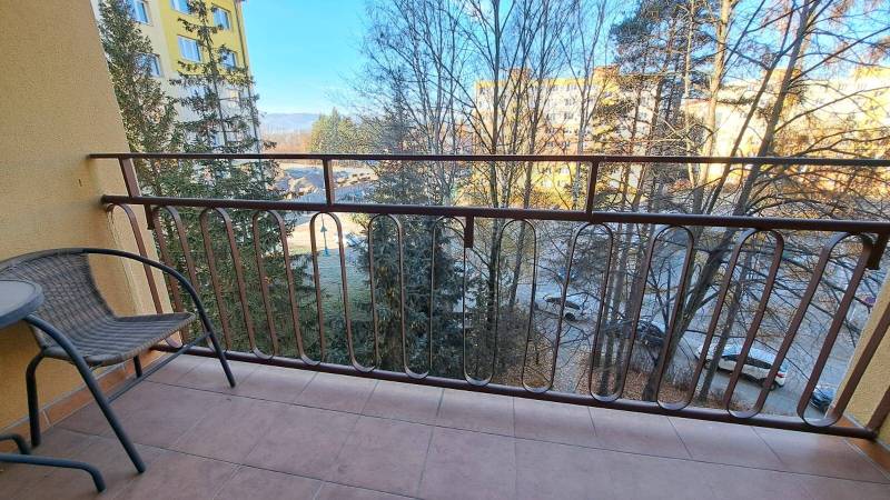 The balcony of a 2-room apartment with a view of greenery and Štúrova Street in Poprad.